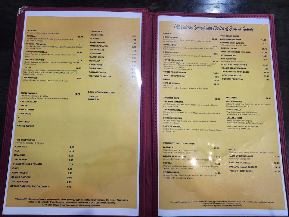 Restaurant interior with booth seating and warm lighting.