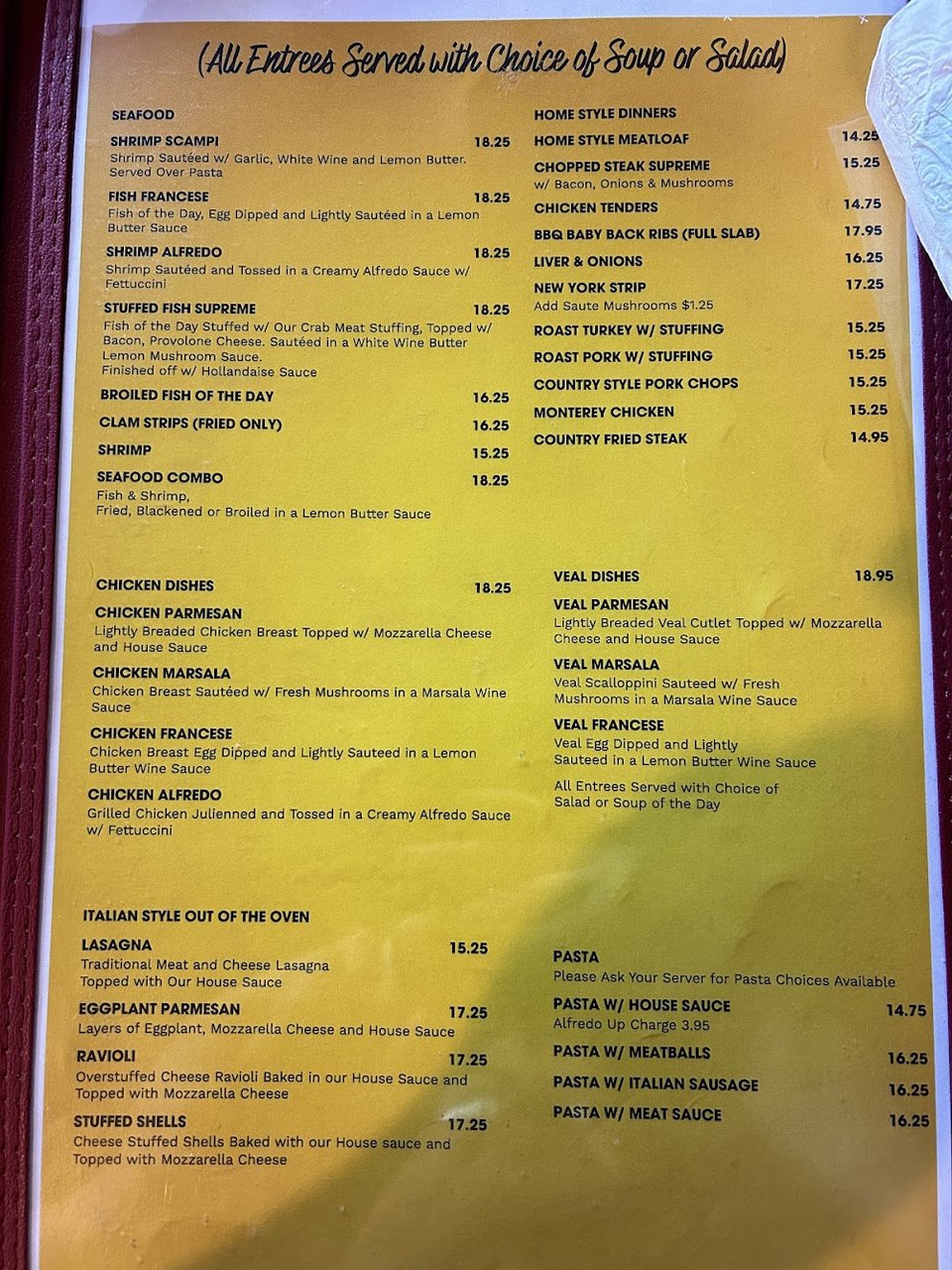 Printed menu featuring wings and salads.